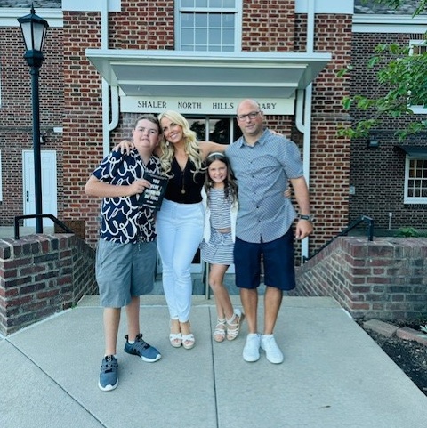 The Spagnolo family posses together in front of Shaler North Hills Library