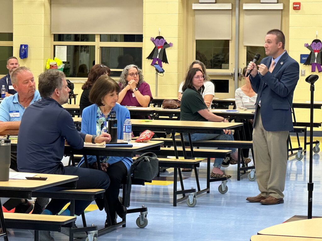 Dr. O'Black addresses the forum