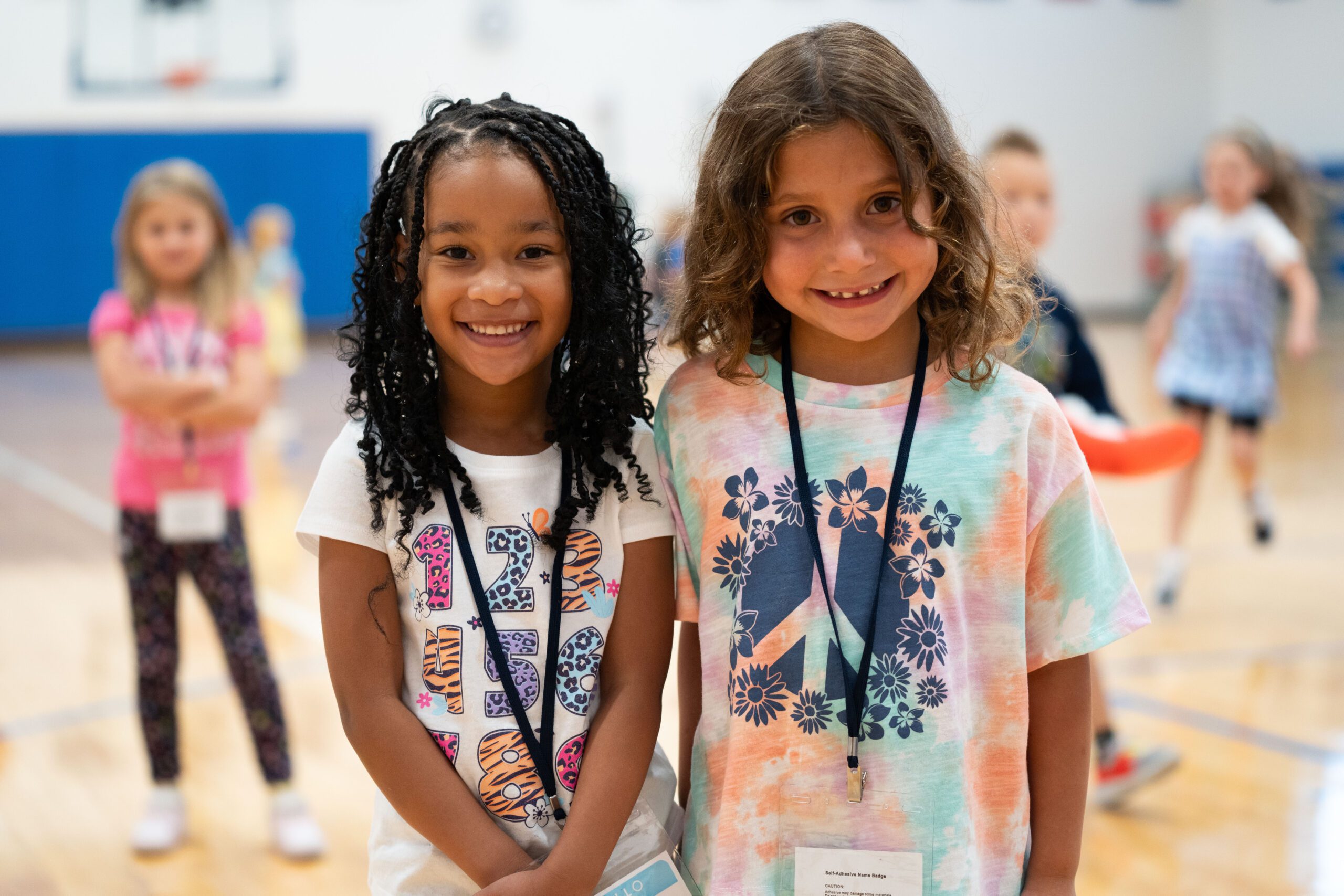 Students smile in the gym