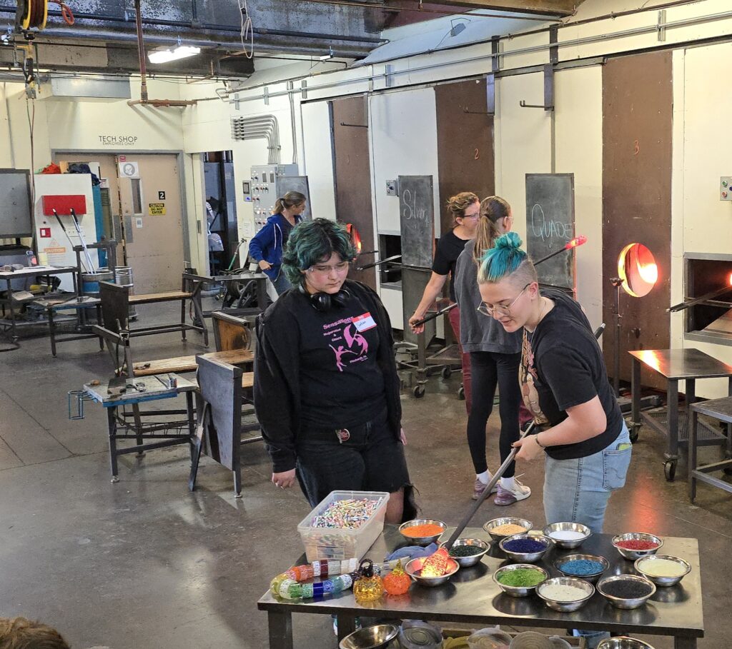 Students work in the glass center