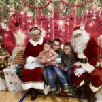 Students pose with Santa and Mrs. Claus