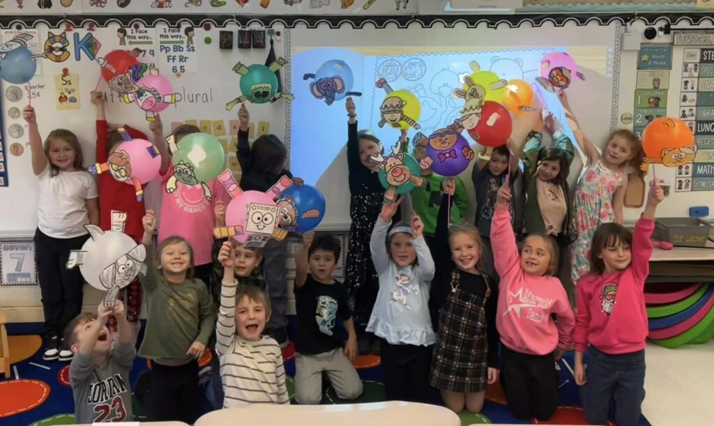 Students wave their balloons