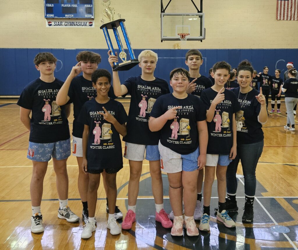 students pose with trophy