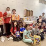 Students smile with donations