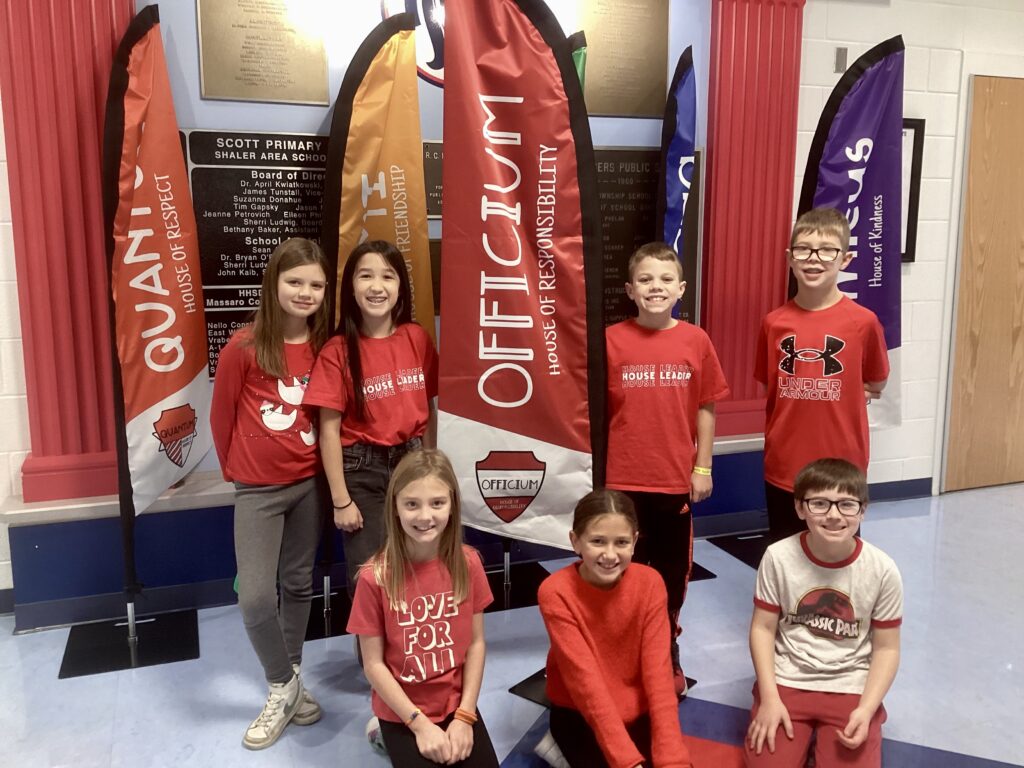 Students pose in red shirts