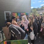 Students place items in the Millvale Food Pantry