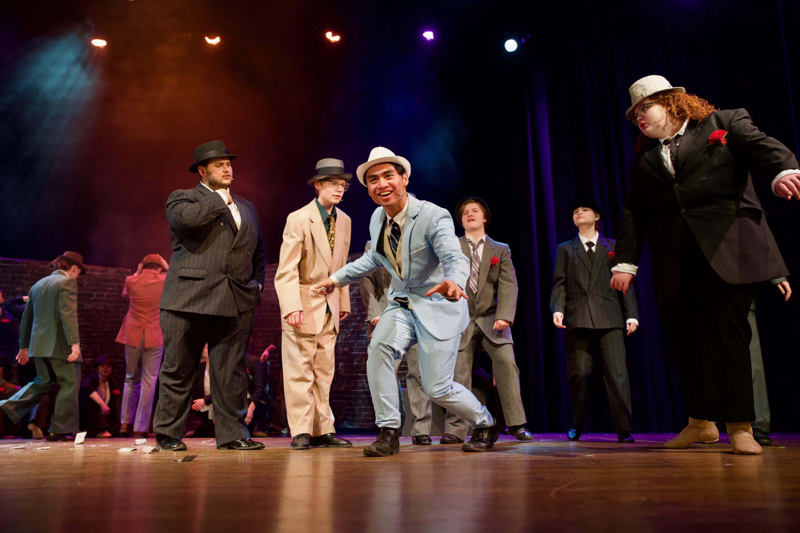 The cast of Guys and Dolls performs