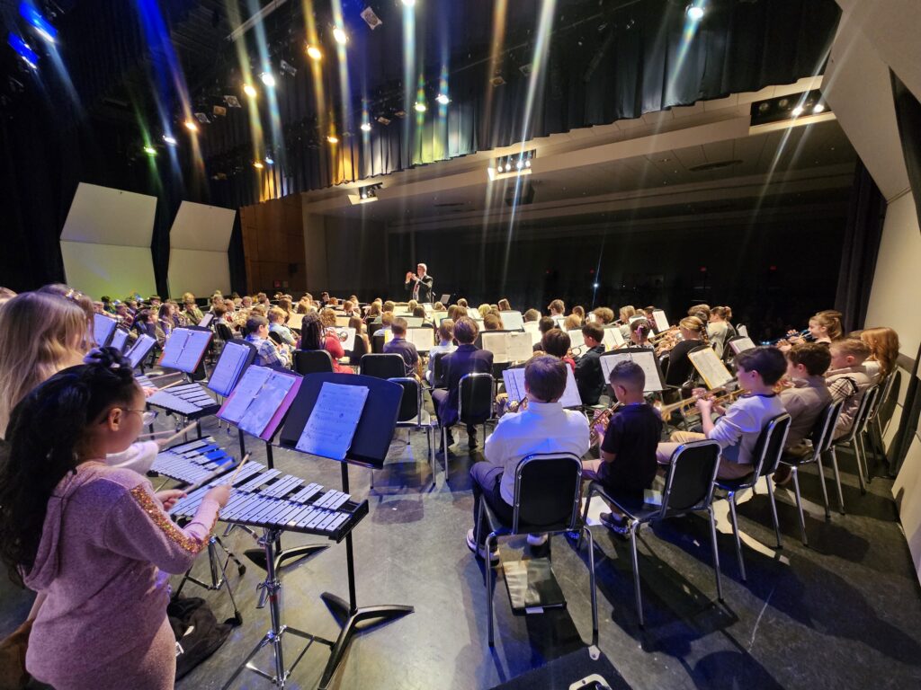 students play on stage