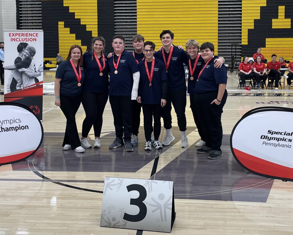 Students pose with their medals