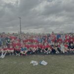 students pose in their running shirts