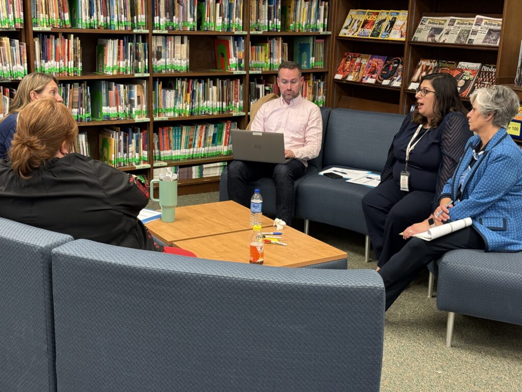 groups discuss in the library