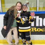 Ryker smiles in his Penguins uniform