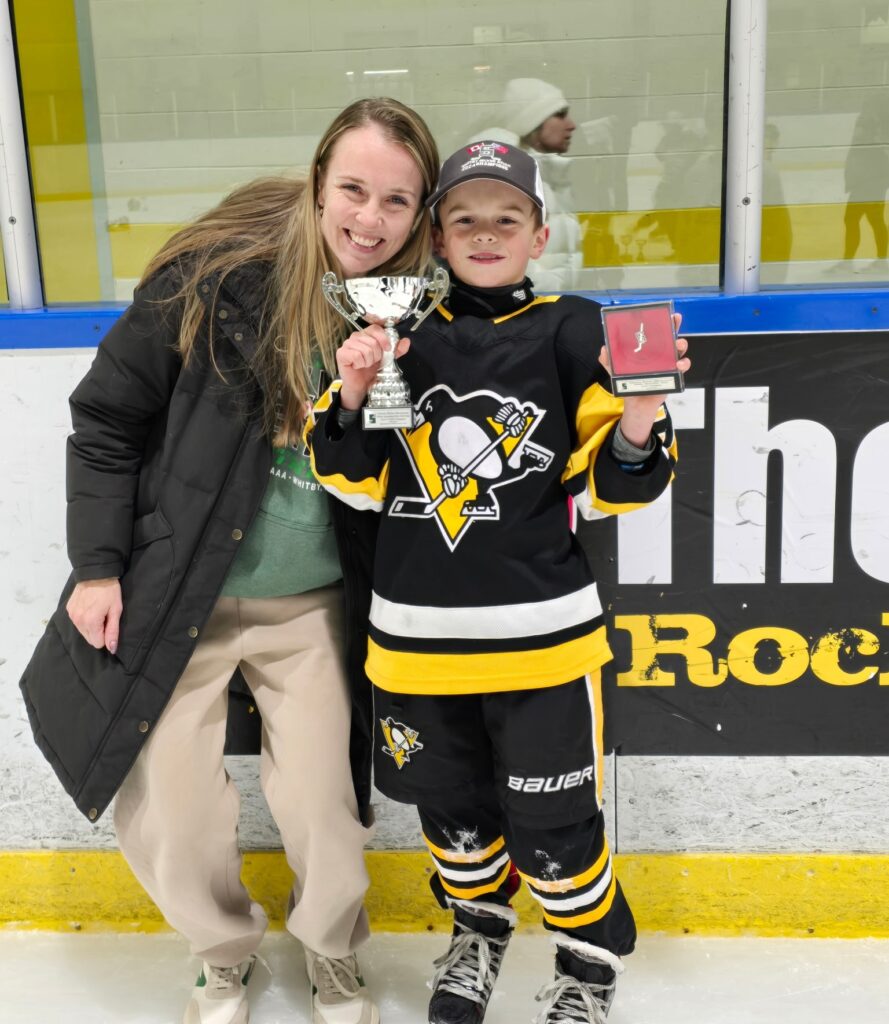 Ryker smiles in his Penguins uniform