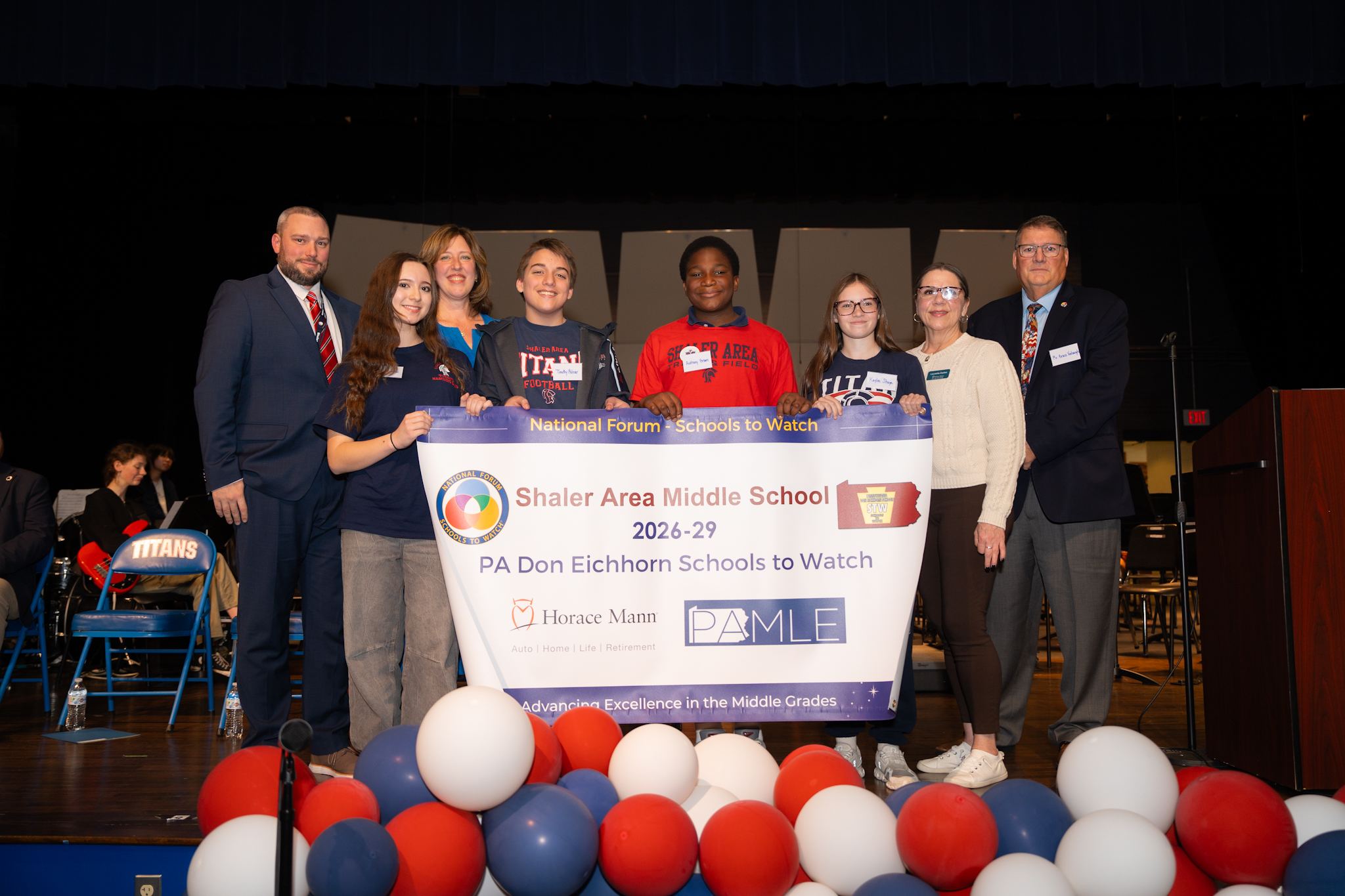 students receive Schools to Watch banner