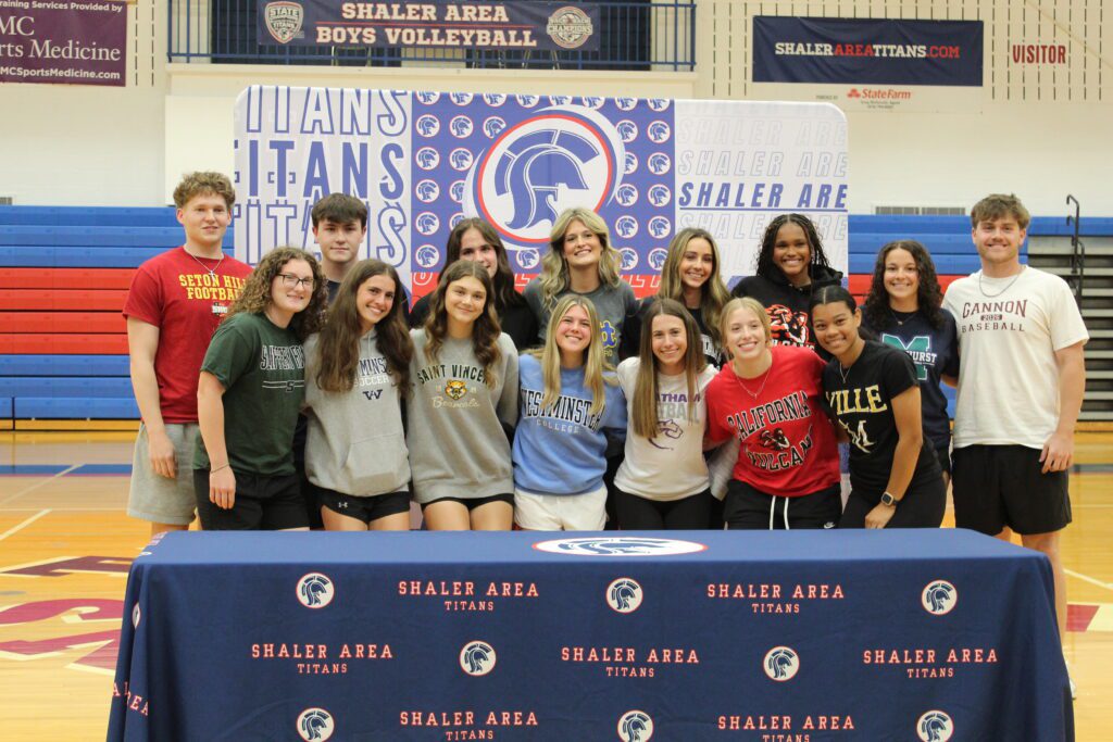 students smile in the high school gym