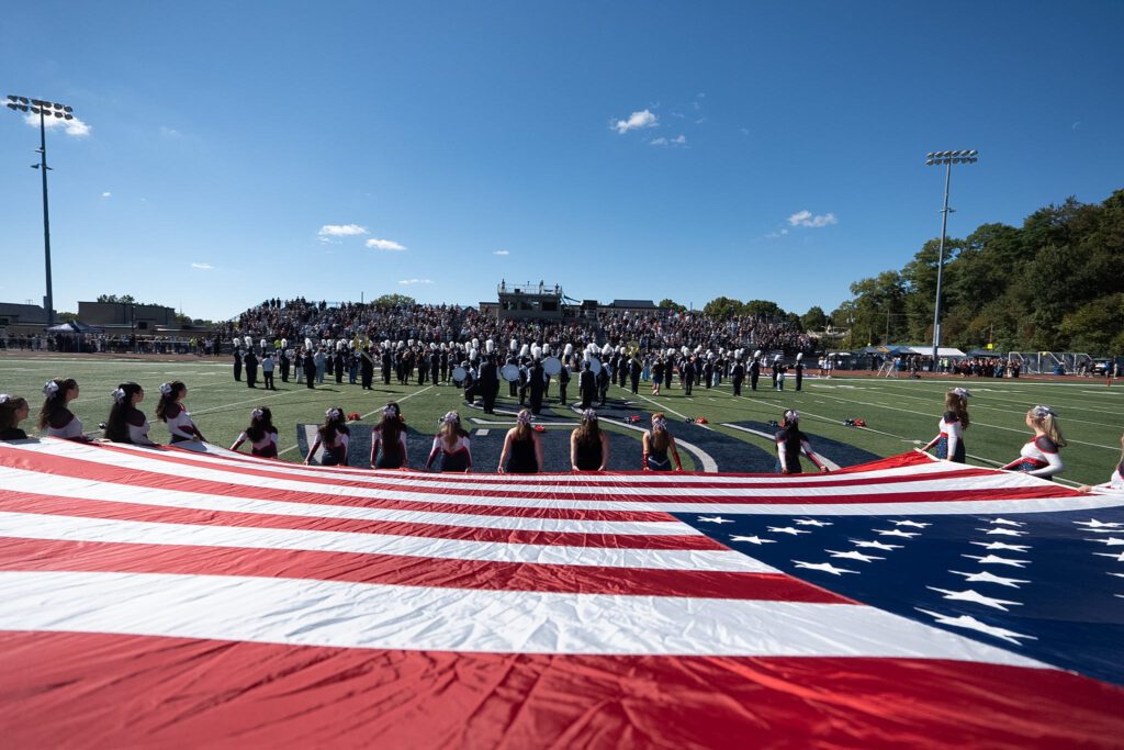 American flag is displayed before the 2026 Homecoming game